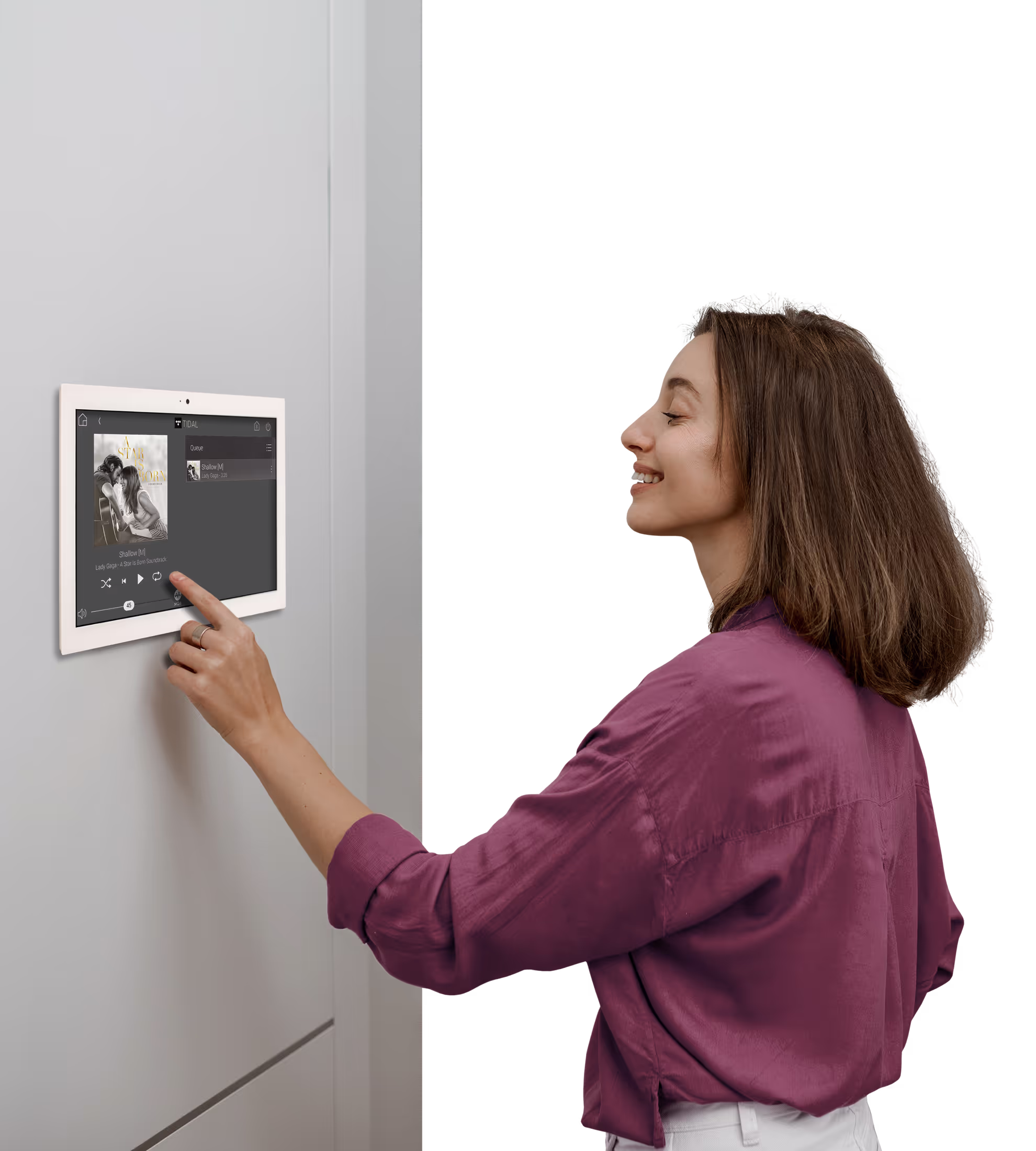 Music in Every Room lady controlling the music from the ipad on the wall